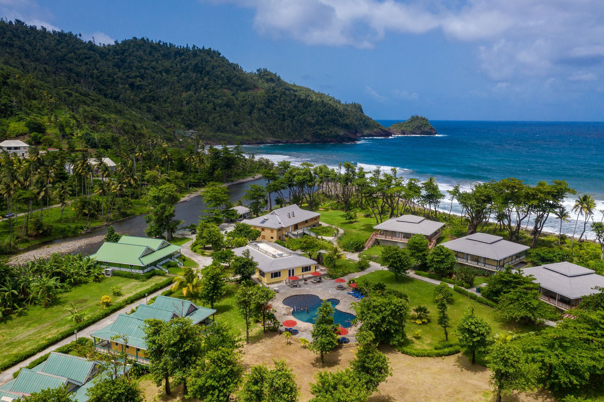 Rosalie Bay’s tropical grounds and cottages beside the Atlantic coast
