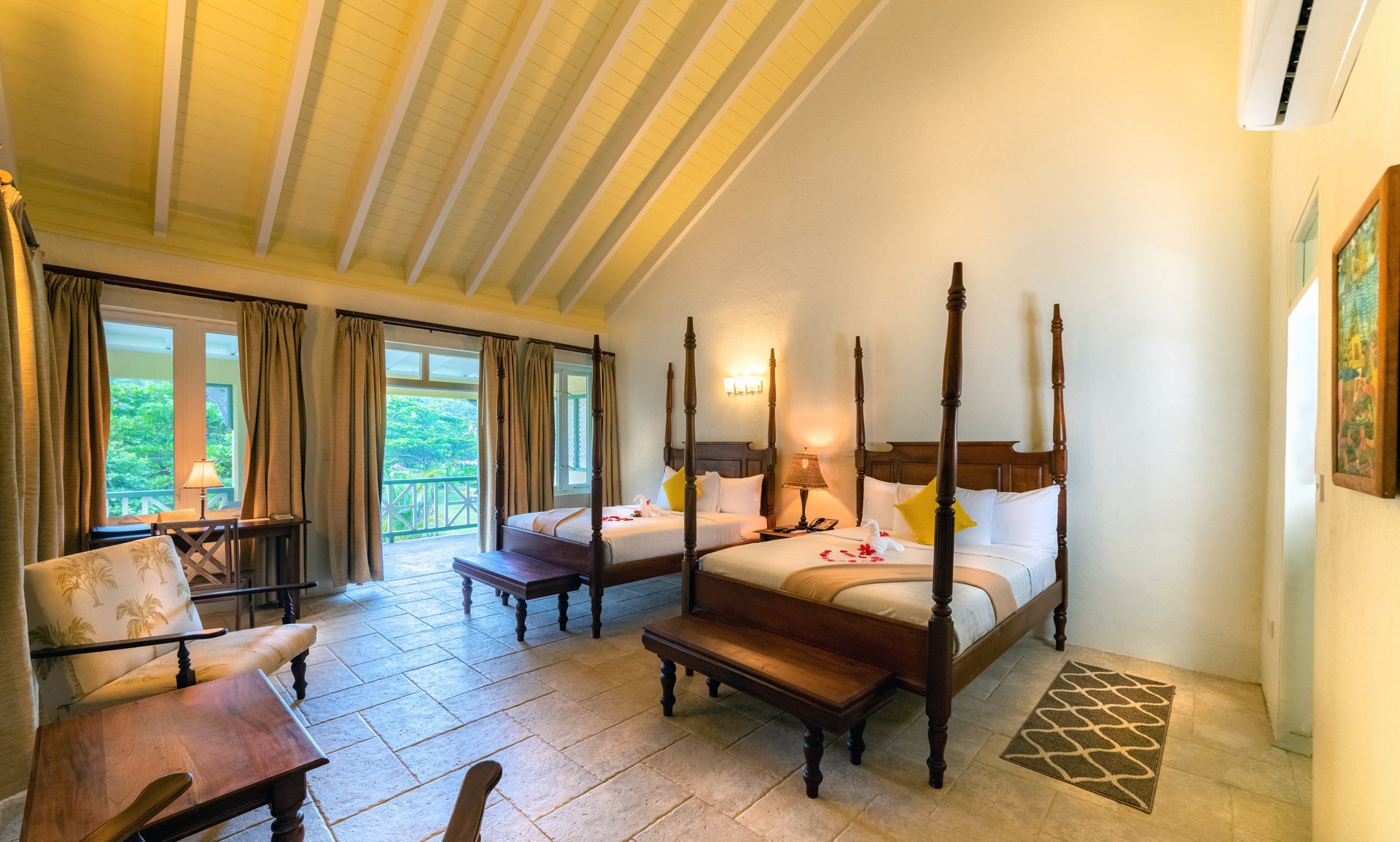 Garden View Premier interior with two queen beds, vaulted timber ceiling and indoor seating